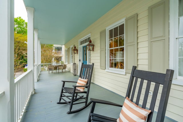 wooden deck featuring covered porch