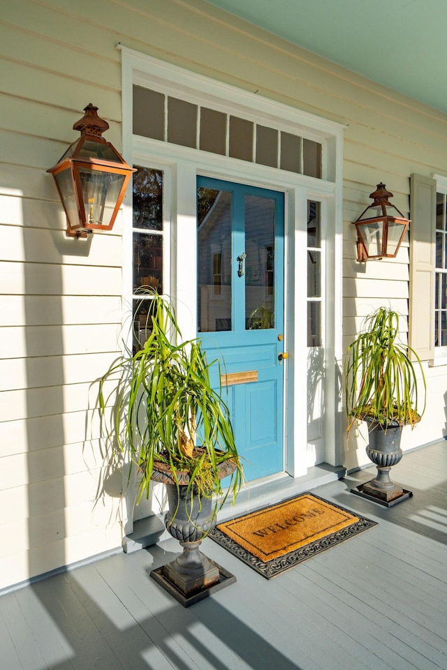 doorway to property featuring a porch