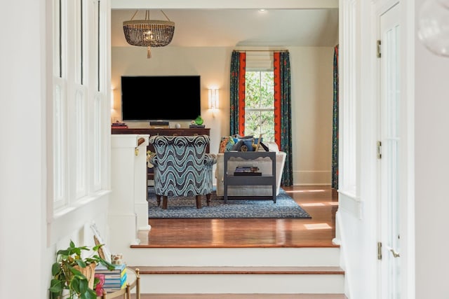 living room featuring a notable chandelier