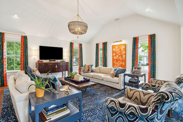 living room featuring a chandelier, lofted ceiling, and wood-type flooring