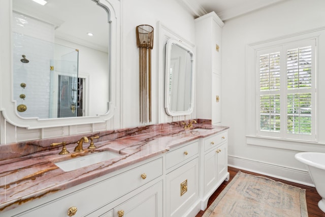 bathroom with separate shower and tub, crown molding, vanity, and wood-type flooring