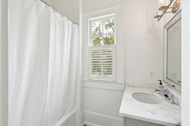 bathroom featuring shower / tub combo with curtain and vanity