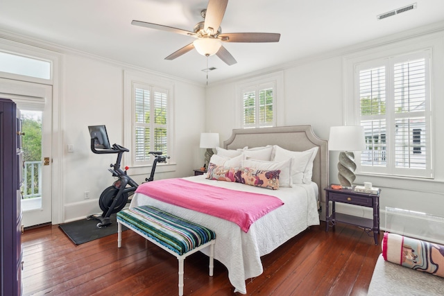 bedroom with ceiling fan, dark wood-type flooring, and ornamental molding