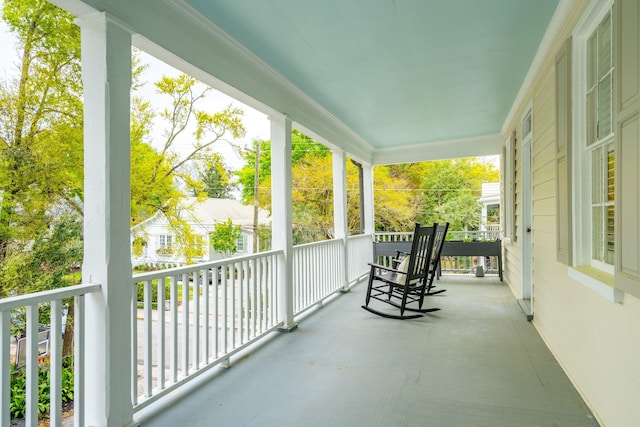 balcony featuring a porch