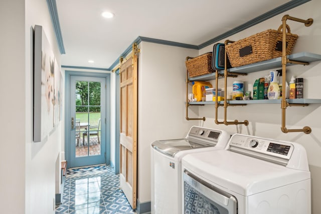 laundry area featuring washer and clothes dryer and ornamental molding