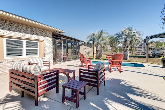 view of patio featuring a shed, outdoor lounge area, and an outdoor structure