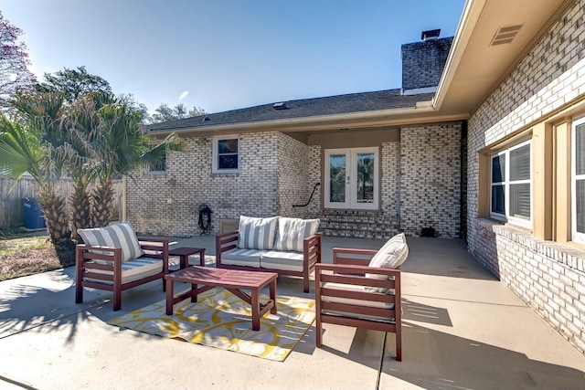 view of patio / terrace featuring an outdoor living space and french doors