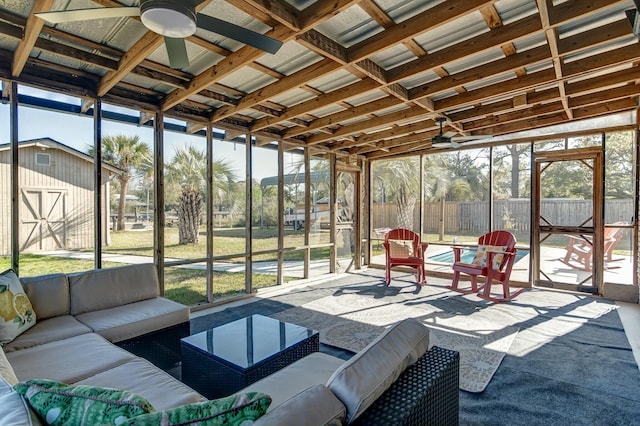 sunroom featuring a ceiling fan