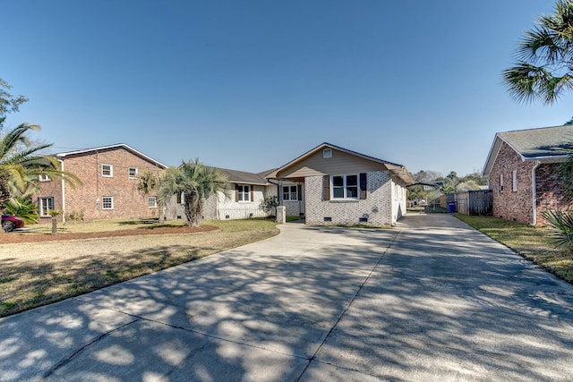 view of front of property with driveway and crawl space