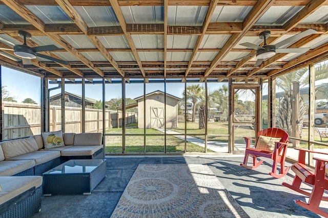 sunroom featuring a healthy amount of sunlight and ceiling fan