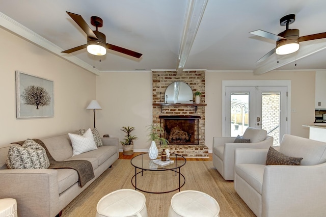 living room featuring beamed ceiling, crown molding, and a ceiling fan