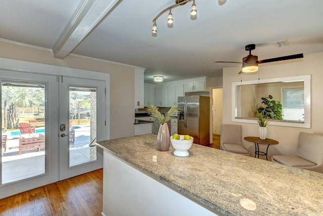 kitchen featuring a ceiling fan, visible vents, stainless steel fridge with ice dispenser, french doors, and light wood-type flooring