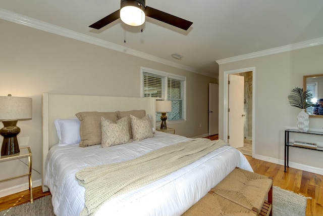 bedroom with visible vents, crown molding, ceiling fan, baseboards, and wood finished floors