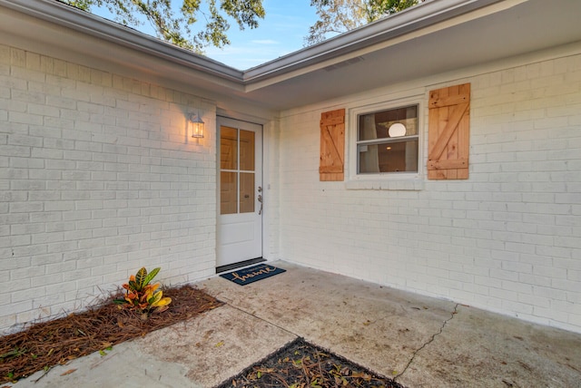 property entrance with a patio area