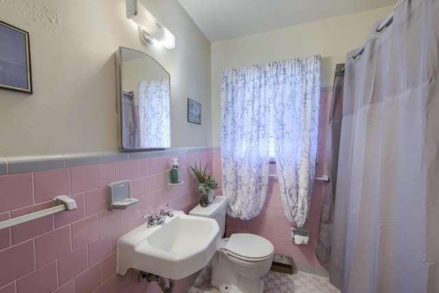 1430 Brian Rd, Charleston, SC 29407 - bathroom with tile walls, a shower with shower curtain, and wainscoting