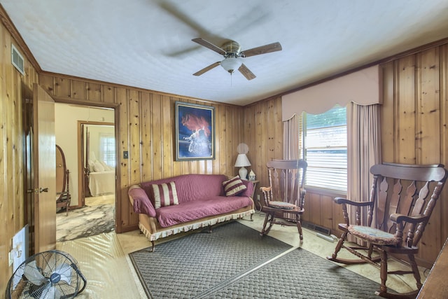 1430 Brian Rd, Charleston, SC 29407 - living area featuring ceiling fan, wood walls, and carpet