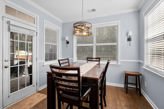 491 Foxbank Plantation Blvd, Moncks Corner, SC 29461 - dining room featuring a chandelier, dark wood finished floors, ornamental molding, and plenty of natural light