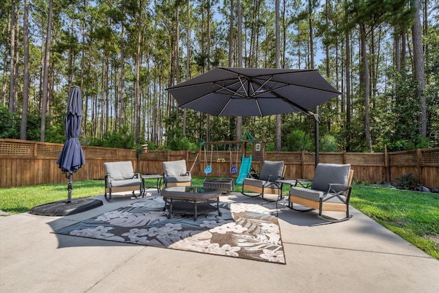 491 Foxbank Plantation Blvd, Moncks Corner, SC 29461 - fenced backyard with a playground, a patio, an outdoor hangout area, and view of scattered trees