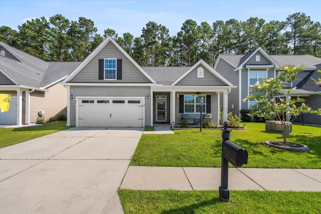 491 Foxbank Plantation Blvd, Moncks Corner, SC 29461 - view of front of property featuring a front lawn, concrete driveway, a garage, and a porch