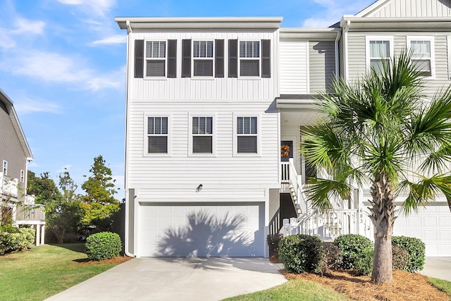681 Mclernon Trce, Johns Island, SC 29455 - view of front of property featuring driveway, an attached garage, and board and batten siding