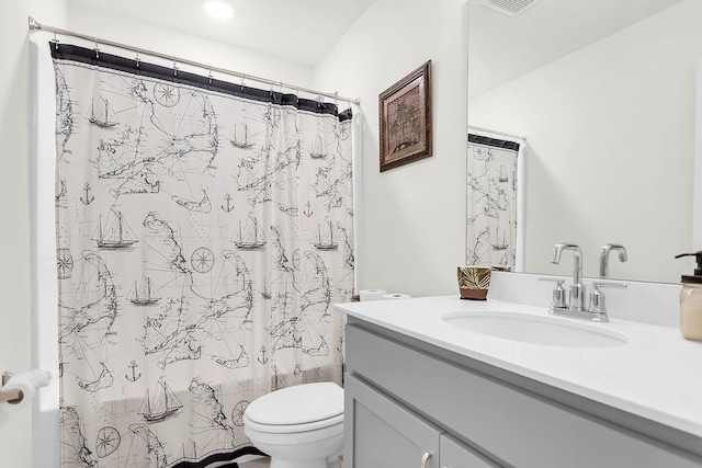 full bathroom with vanity, toilet, and shower / tub combo with curtain