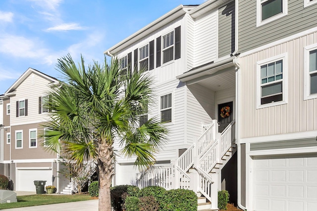 681 Mclernon Trce, Johns Island, SC 29455 - view of building exterior featuring stairs and an attached garage