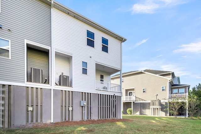 rear view of property with a yard