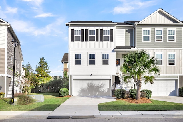 view of front facade with a garage and a front lawn