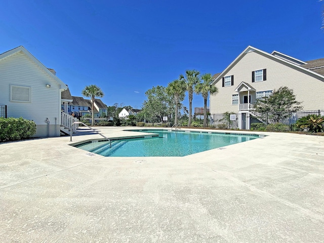 view of swimming pool with a patio area