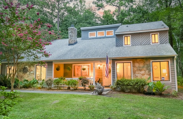 view of front of home featuring a yard and a porch