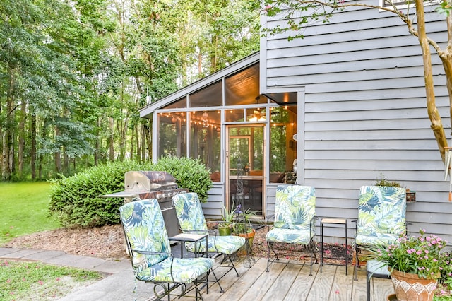 wooden terrace featuring a sunroom