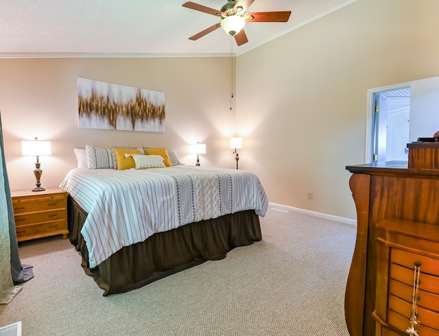 carpeted bedroom with ornamental molding, vaulted ceiling, and ceiling fan