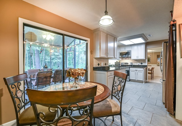 dining space with light tile patterned floors