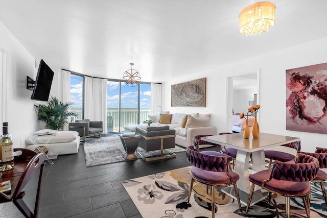 living room featuring a wall of windows and an inviting chandelier