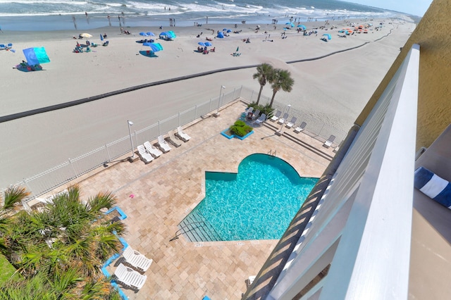 bird's eye view with a water view and a view of the beach