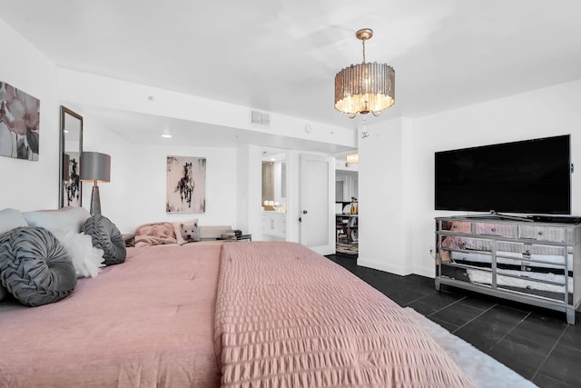 tiled bedroom featuring connected bathroom