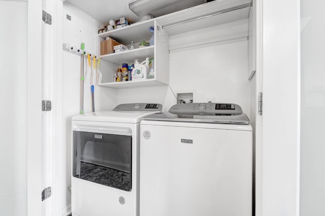 laundry room featuring separate washer and dryer