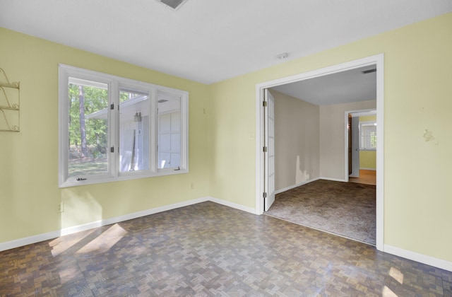 empty room featuring baseboards