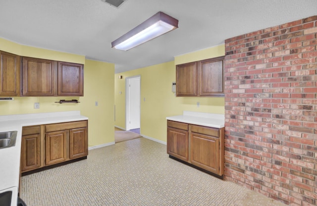 kitchen with light countertops and baseboards