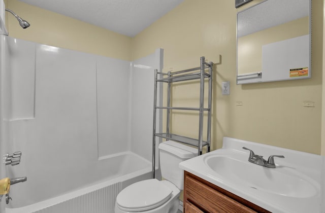 bathroom with toilet, shower / tub combination, and vanity