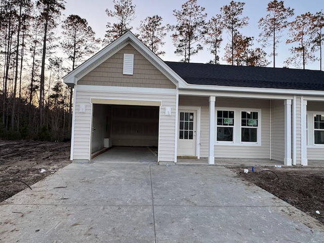 single story home featuring a garage