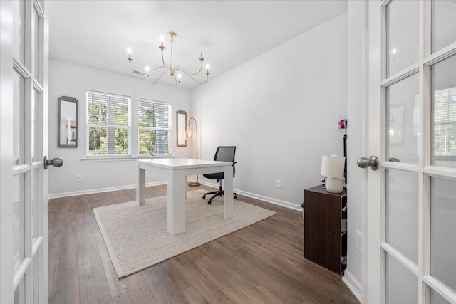 office area with french doors, dark hardwood / wood-style floors, and a notable chandelier