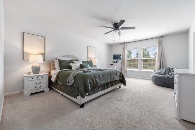 bedroom featuring light colored carpet and ceiling fan