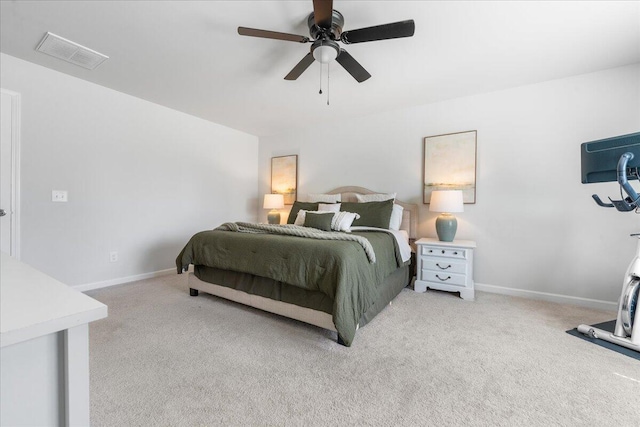 bedroom with ceiling fan and light colored carpet