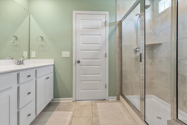 bathroom featuring vanity, tile patterned floors, and an enclosed shower