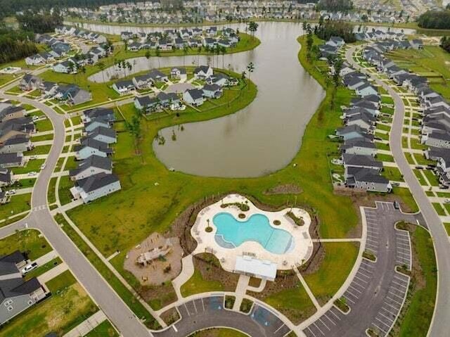 birds eye view of property featuring a water view