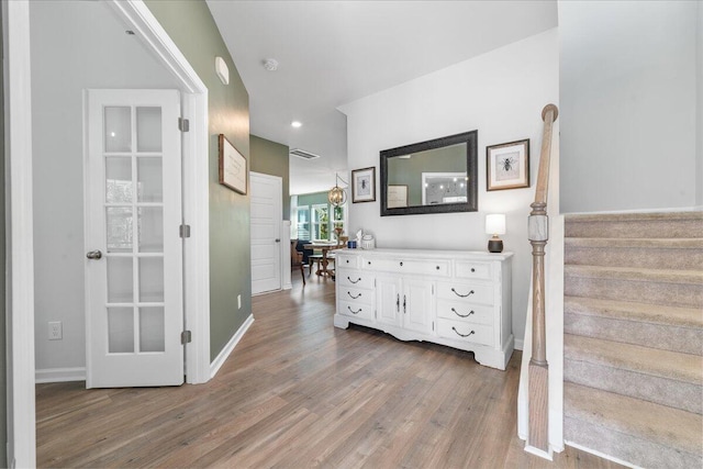 hallway with wood-type flooring