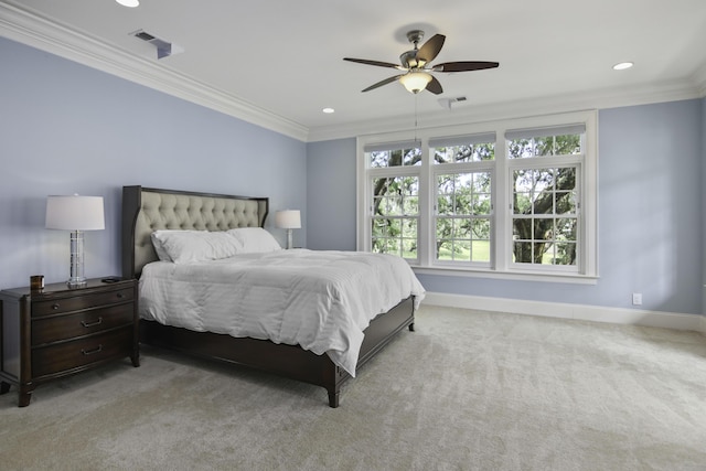 carpeted bedroom featuring ornamental molding and ceiling fan