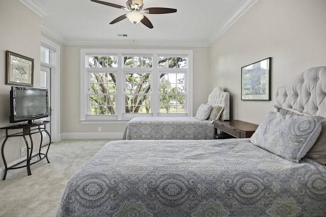 carpeted bedroom with crown molding and ceiling fan