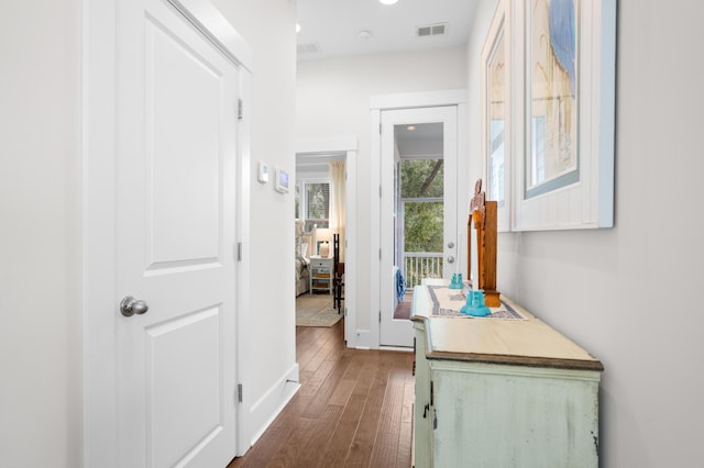 hallway with dark hardwood / wood-style flooring